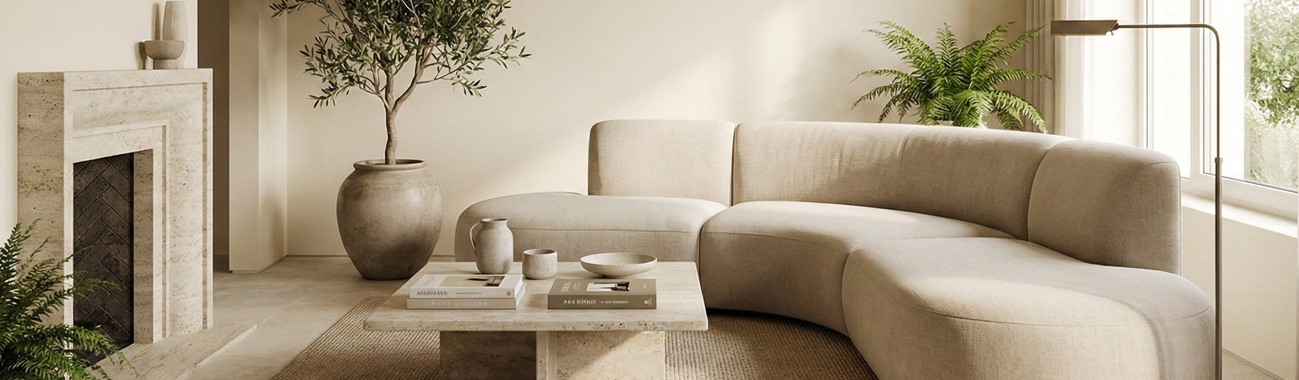 Modern living room with a beige sectional sofa, coffee table, and decorative elements.