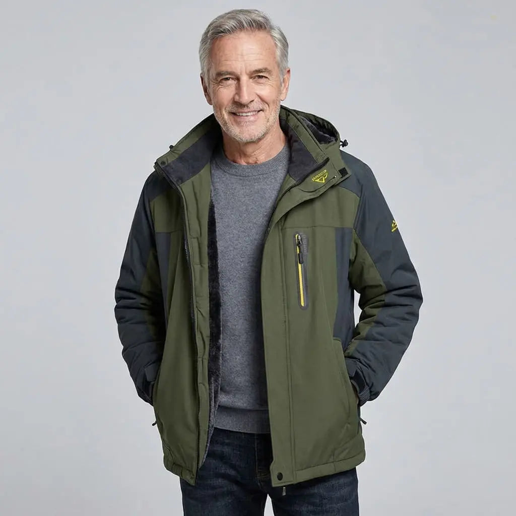 Man wearing a green and black jacket on a light gray background